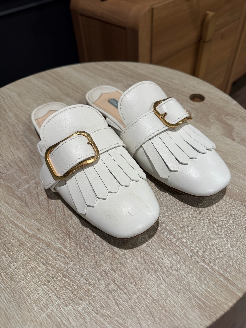 Prada 39.5 White Fringe Leather Backless Mules with Gold Buckles